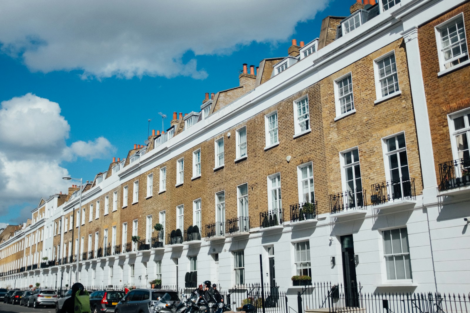 London terraced homes with brick façades and white balconies